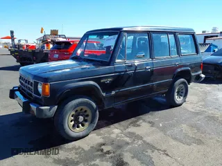 1990 Mitsubishi Montero z VIN JA4GJ51S9LJ002086, wystawiony jako IAAI lot #41643120 z przebiegiem 198 215 mil mil oraz . Historia ofert i sprzedaży dostępna na DreamBid. Obrazek 2.