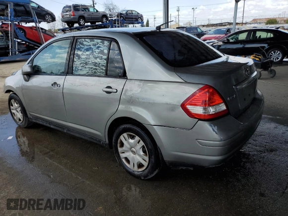2011 Nissan Versa S with VIN 3N1BC1AP3BL404551, listed as a Copart auction lot 51977085 with 207,070 mi miles and Salvage title. Bid and sale history available at DreamBid. Image 2.