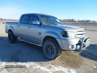 2005 Toyota Tundra SR5 with VIN 5TBDT44165S499774, listed as a IAAI auction lot 41417325 with 220,476 mi miles and . Bid and sale history available at DreamBid. Image 1.