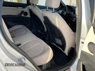 2017 BMW X1 sDrive28i with VIN WBXHU7C39H5H34971, listed as a Copart auction lot 51869265 with 108,051 mi miles and Clean Title. Bid and sale history available at carsss.com. Image 6.