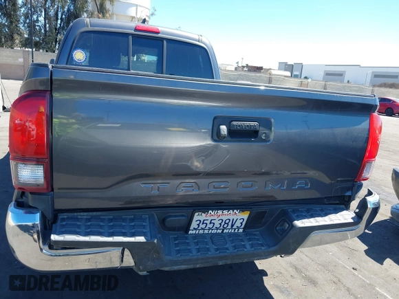 2018 Toyota Tacoma SR with VIN 5TFRX5GN1JX118441, listed as a IAAI auction lot 41870266 with 95,612 mi miles and . Bid and sale history available at DreamBid. Image 6.
