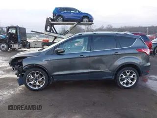 2015 Ford Escape Titanium with VIN 1FMCU0J92FUB74972, listed as a IAAI auction lot 41164519 with 228,785 mi miles and . Bid and sale history available at DreamBid. Image 14.