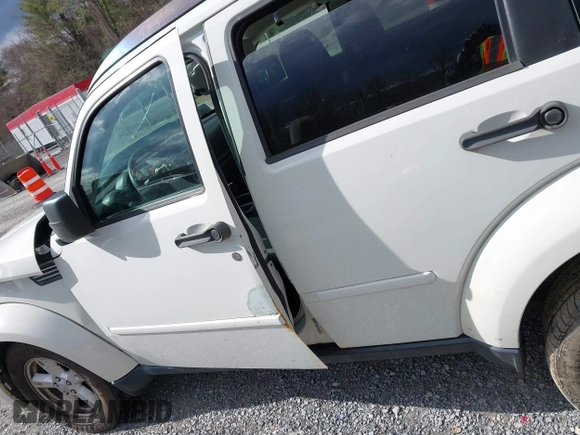 2007 Dodge Nitro SXT with VIN 1D8GU28K77W727391, listed as a IAAI auction lot 41869288 with 214,920 mi miles. Bid and sale history available at carsss.com. Image 20.
