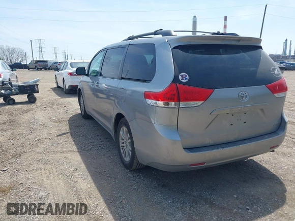 2014 Toyota Sienna XLE with VIN 5TDYK3DC9ES413283, listed as a IAAI auction lot 42091379 with 184,506 mi miles and . Bid and sale history available at DreamBid. Image 3.
