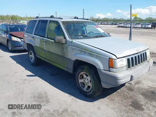 1996 Jeep Grand Cherokee Laredo with VIN 1J4FX58S2TC397006, listed as a IAAI auction lot 41836108 with 136,742 mi miles. Bid and sale history available at carsss.com. Image 1.