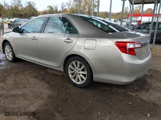 2014 Toyota Camry Hybrid LE with VIN 4T1BD1FK4EU106488, listed as a IAAI auction lot 40794286 with 98,911 mi miles. Bid and sale history available at carsss.com. Image 3.