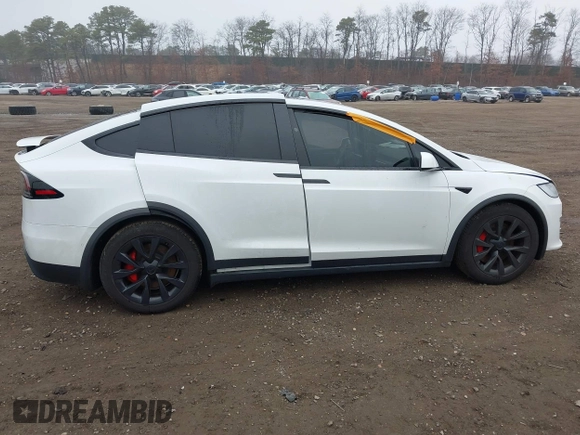 2022 Tesla Model X Plaid z VIN 7SAXCBE67NF339557, wystawiony jako IAAI lot #41825360 z przebiegiem 70 mil mil oraz . Historia ofert i sprzedaży dostępna na DreamBid. Obrazek 13.