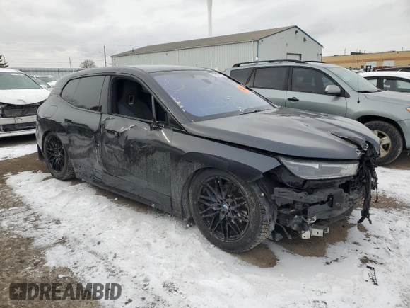 2022 BMW iX xDrive50 with VIN WB523CF05NCJ43021, listed as a Copart auction lot 87864125 with 28,976 mi miles and Salvage Title. Bid and sale history available at carsss.com. Image 4.