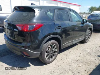 2016 Mazda CX-5 Grand Touring with VIN JM3KE4DY9G0893174, listed as a IAAI auction lot 41887814 with 79,811 mi miles. Bid and sale history available at carsss.com. Image 4.