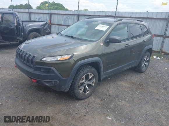 2014 Jeep Cherokee Trailhawk z VIN 1C4PJMBBXEW232210, wystawiony jako IAAI lot #42143917 z przebiegiem 113 603 mil mil oraz . Historia ofert i sprzedaży dostępna na DreamBid. Obrazek 2.