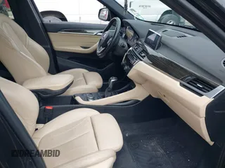2018 BMW X1 xDrive28i with VIN WBXHT3C34J5K31430, listed as a IAAI auction lot 41954792 with 125,447 mi miles. Bid and sale history available at carsss.com. Image 5.