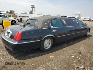 1999 Lincoln Town Car Executive with VIN 1L1FM81W8XY710157, listed as a Copart auction lot 59804965 with Not provided miles and Salvage title. Bid and sale history available at DreamBid. Image 3.