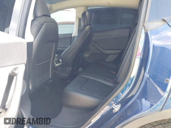 2021 Tesla Model Y Standard Range z VIN 5YJYGDED6MF107711, wystawiony jako IAAI lot #41794384 z przebiegiem 86 934 mil mil oraz . Historia ofert i sprzedaży dostępna na DreamBid. Obrazek 8.