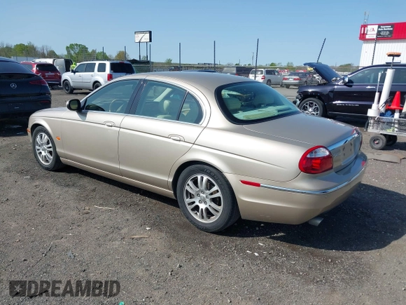2005 Jaguar S-Type with VIN SAJWA01T95FN22745, listed as a IAAI auction lot 41898269 with 57,614 mi miles and . Bid and sale history available at DreamBid. Image 3.