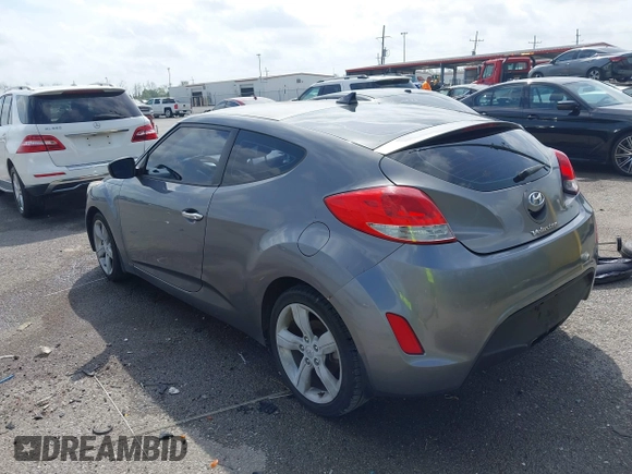 2013 Hyundai Veloster w/Black Int with VIN KMHTC6AD6DU169765, listed as a IAAI auction lot 41928516 with 130,708 mi miles and . Bid and sale history available at DreamBid. Image 3.