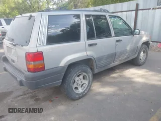 1998 Jeep Grand Cherokee Laredo with VIN 1J4GZ58S6WC319265, listed as a IAAI auction lot 42619853 with 238,667 mi miles and . Bid and sale history available at DreamBid. Image 4.