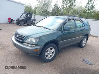1999 Lexus RX 300 Luxury SUV with VIN JT6HF10U0X0034001, listed as a IAAI auction lot 41804468 with 166,072 mi miles. Bid and sale history available at carsss.com. Image 2.