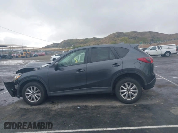 2016 Mazda CX-5 Touring with VIN JM3KE2CY7G0630056, listed as a IAAI auction lot 41817525 with 97,844 mi miles and . Bid and sale history available at DreamBid. Image 14.