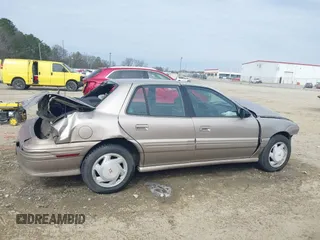1997 Pontiac Grand Am SE with VIN 1G2NE52T1VC761092, listed as a IAAI auction lot 41547391 with 297,392 mi miles. Bid and sale history available at carsss.com. Image 14.