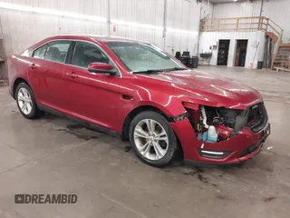 2015 Ford Taurus SEL z VIN 1FAHP2E81FG188655, wystawiony jako IAAI lot #42124085 z przebiegiem 198 598 mil mil oraz . Historia ofert i sprzedaży dostępna na DreamBid. Obrazek 1.