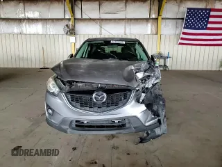 2014 Mazda CX-5 Touring z VIN JM3KE2CY7E0349484, wystawiony jako Copart lot #51188665 z przebiegiem 175 131 mil mil oraz Szkoda całkowita • Salvage title. Historia ofert i sprzedaży dostępna na DreamBid. Obrazek 11.