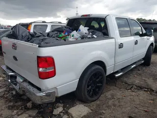 2005 Ford F-150 XLT with VIN 1FTRW12W35KC97855, listed as a IAAI auction lot 41726385 with 295,397 mi miles. Bid and sale history available at carsss.com. Image 4.