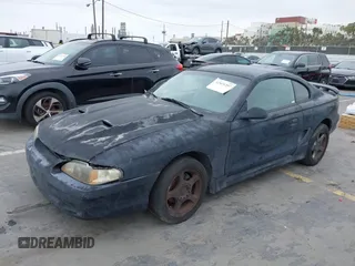 1998 Ford Mustang with VIN 1FAFP4042WF255177, listed as a IAAI auction lot 42421207 with 166,864 mi miles and . Bid and sale history available at DreamBid. Image 2.