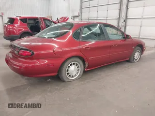 1998 Ford Taurus SE Comfort z VIN 1FAFP53S4WA168846, wystawiony jako IAAI lot #42482348 z przebiegiem 140 194 mil mil oraz . Historia ofert i sprzedaży dostępna na DreamBid. Obrazek 4.