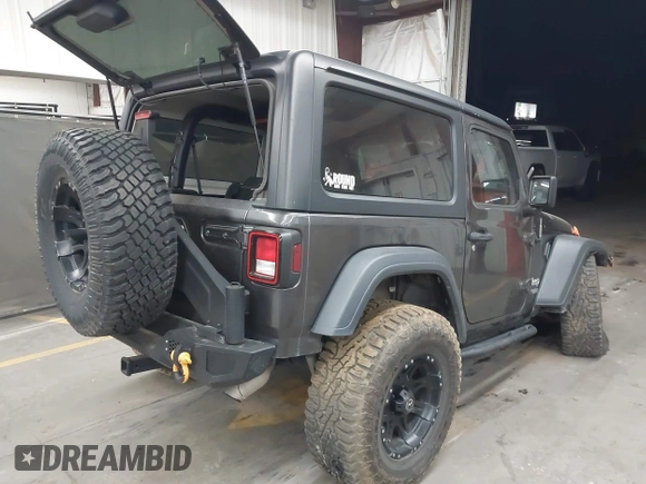 2020 Jeep Wrangler Sport S with VIN 1C4GJXAN4LW229040, listed as a IAAI auction lot 42172180 with 58,701 mi miles and . Bid and sale history available at DreamBid. Image 4.