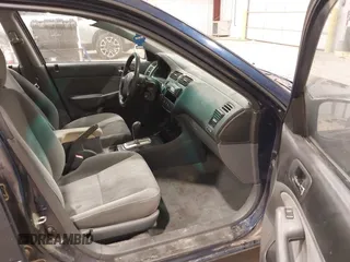 2004 Honda Civic LX with VIN 2HGES16574H587907, listed as a IAAI auction lot 42130597 with 214,451 mi miles and . Bid and sale history available at carsss.com. Image 5.
