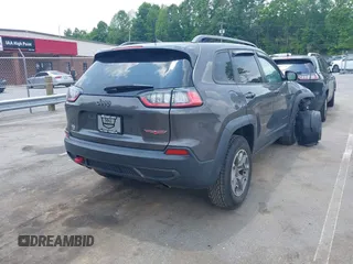2020 Jeep Cherokee Trailhawk with VIN 1C4PJMBX5LD530720, listed as a IAAI auction lot 42404948 with 99,606 mi miles and . Bid and sale history available at DreamBid. Image 4.