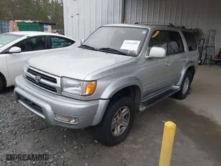 1999 Toyota 4Runner Limited with VIN JT3HN87R4X0215077, listed as a IAAI auction lot 41563450 with 472,388 mi miles. Bid and sale history available at carsss.com. Image 2.