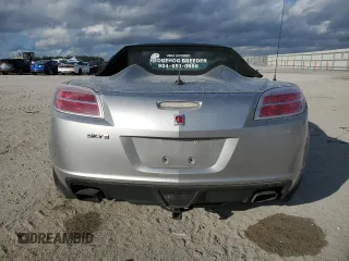 2009 Saturn Sky Red Line z VIN 1G8MT35X69Y104310, wystawiony jako Copart lot #87369754 z przebiegiem 62 428 mil mil oraz Szkody całkowita. Historia ofert i sprzedaży dostępna na DreamBid. Obrazek 6.