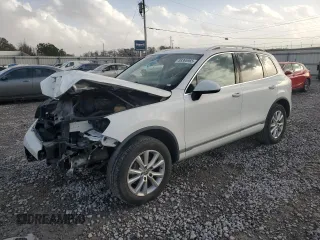 2014 Volkswagen Touareg Sport with VIN WVGEF9BP2ED005912, listed as a Copart auction lot 88365965 with 128,126 mi miles and Salvage Title. Bid and sale history available at DreamBid. Image 1.