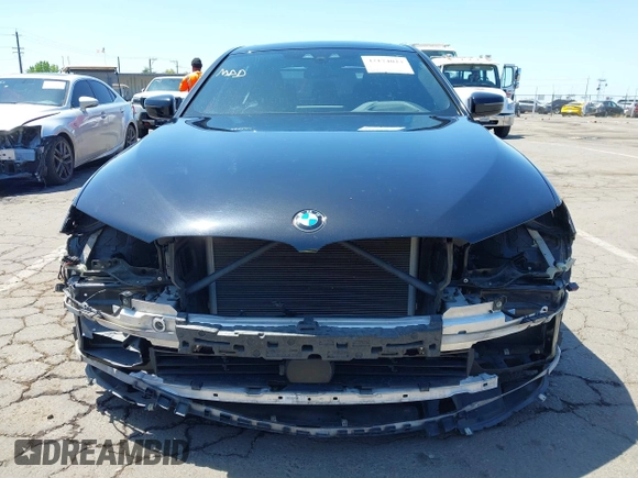 2017 BMW 5 Series 540i with VIN WBAJE5C31HG477822, listed as a IAAI auction lot 42174024 with 88,846 mi miles and . Bid and sale history available at carsss.com. Image 12.
