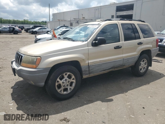 1999 Jeep Grand Cherokee Laredo with VIN 1J4GW58N7XC799434, listed as a Copart auction lot 64790905 with 272,384 mi miles and Salvage title. Bid and sale history available at DreamBid. Image 1.