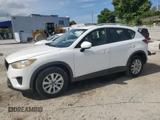 2014 Mazda CX-5 Sport with VIN JM3KE2BE9E0344990, listed as a Copart auction lot 59014145 with 126,905 mi miles and Salvage title. Bid and sale history available at DreamBid. Image 1.