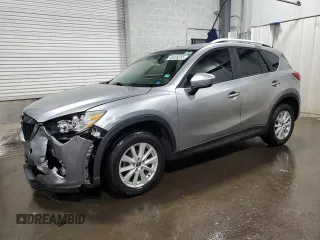2014 Mazda CX-5 Touring with VIN JM3KE2CY8E0385958, listed as a Copart auction lot 60926255 with 123,191 mi miles and Salvage title. Bid and sale history available at DreamBid. Image 1.