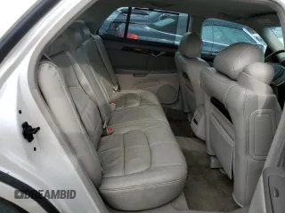 2002 Cadillac DeVille DHS z VIN 1G6KE57Y42U277428, wystawiony jako Copart lot #45757115 z przebiegiem 143 741 mil mil oraz Czysty tytuł • Clean title. Historia ofert i sprzedaży dostępna na DreamBid. Obrazek 10.