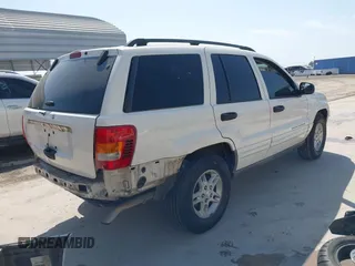 2003 Jeep Grand Cherokee Laredo with VIN 1J4GX48S43C518584, listed as a IAAI auction lot 42213094 with 163,743 mi miles and . Bid and sale history available at DreamBid. Image 4.