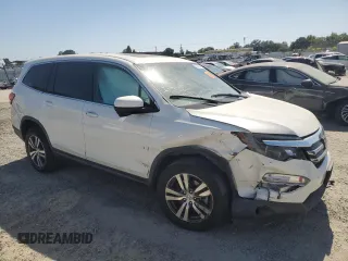 2018 Honda Pilot EX-L with VIN 5FNYF6H54JB013986, listed as a Copart auction lot 60743165 with 124,373 mi miles and Salvage title. Bid and sale history available at DreamBid. Image 4.