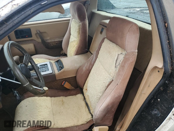 1984 Pontiac Fiero z VIN 1G2AF37R6EP320306, wystawiony jako Copart lot #68255394 z przebiegiem 49 284 mil mil oraz Czysty tytuł • Clean title. Historia ofert i sprzedaży dostępna na DreamBid. Obrazek 10.