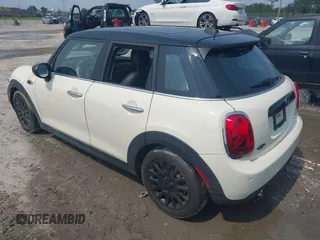 2020 MINI Hardtop 4 Door Cooper with VIN WMWXU7C01L2M54710, listed as a IAAI auction lot 42385956 with 55,714 mi miles and . Bid and sale history available at DreamBid. Image 3.