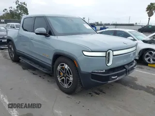 2023 Rivian R1T Launch Edition with VIN 7FCTGAAL3PN017339, listed as a IAAI auction lot 42041423 with 15,098 mi miles. Bid and sale history available at carsss.com. Image 1.