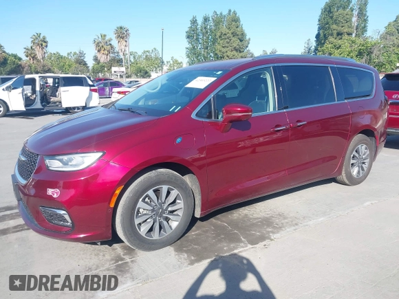 2021 Chrysler Pacifica Hybrid Touring L with VIN 2C4RC1L76MR581285, listed as a IAAI auction lot 42303222 with 77,808 mi miles and . Bid and sale history available at DreamBid. Image 17.