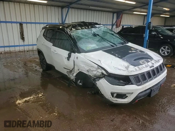 2019 Jeep Compass Trailhawk z VIN 3C4NJDDB3KT671061, wystawiony jako Copart lot #57349315 z przebiegiem Nie podano mil oraz Szkoda całkowita • Salvage title. Historia ofert i sprzedaży dostępna na DreamBid. Obrazek 14.