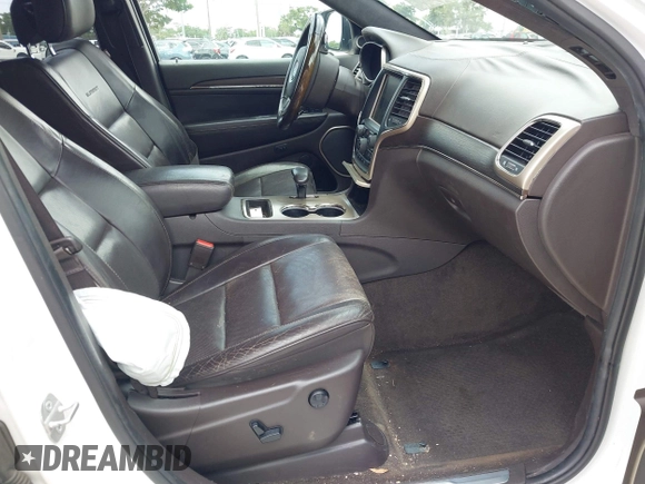 2014 Jeep Grand Cherokee Summit z VIN 1C4RJEJG1EC357948, wystawiony jako IAAI lot #42498652 z przebiegiem 213 715 mil mil oraz . Historia ofert i sprzedaży dostępna na DreamBid. Obrazek 5.