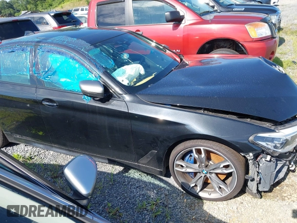 2018 BMW 5 Series M550i xDrive с VIN WBAJB9C59JB286170, выставлен на аукционе IAAI как лот 42726658 с пробегом Не указан миль и . История ставок и продаж доступна на DreamBid. Изображение 12.