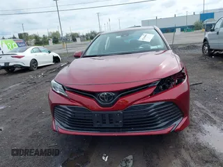 2019 Toyota Camry LE with VIN 4T1B11HK8KU823736, listed as a IAAI auction lot 42166696 with 21,732 mi miles and . Bid and sale history available at DreamBid. Image 12.