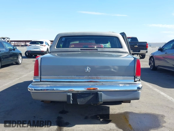 1991 Chrysler New Yorker z VIN 1C3XY66R2MD228813, wystawiony jako IAAI lot #42257734 z przebiegiem 45 786 mil mil oraz . Historia ofert i sprzedaży dostępna na DreamBid. Obrazek 17.
